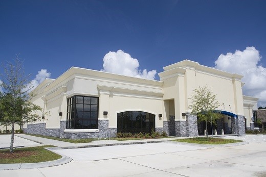 beige stucco with gray brick retail store